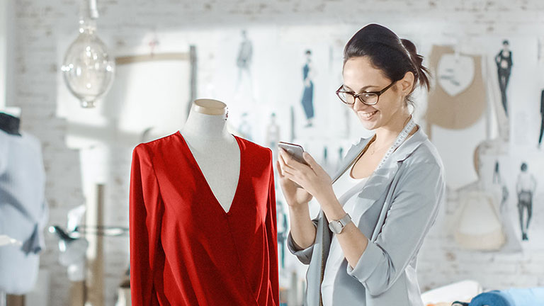Clothing designer choosing insurance coverage for her business