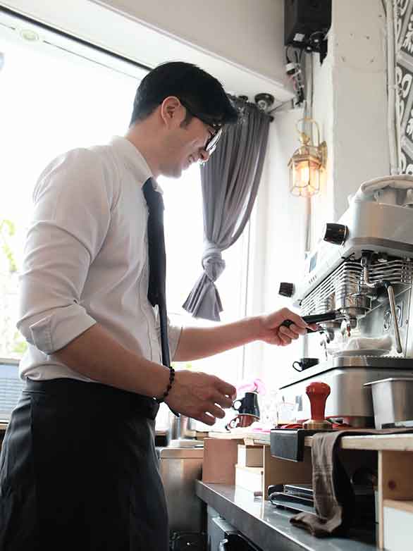 Busy cafe owner focused on helping customers
